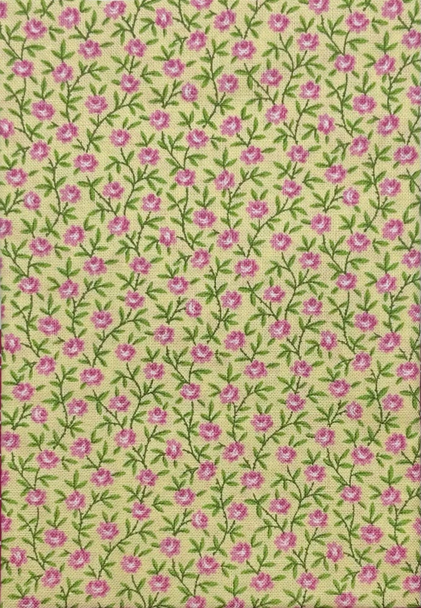 Pink flowers on yellow cotton
