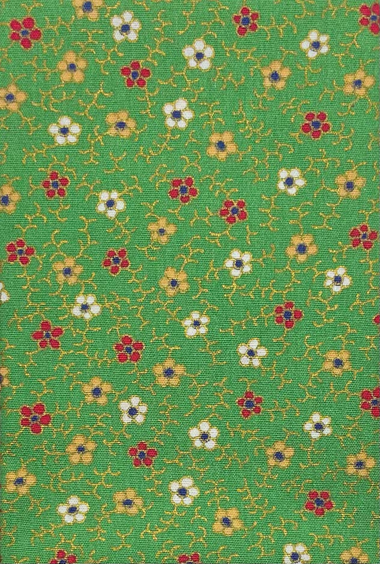 Floral print on green cotton with metallic detailing