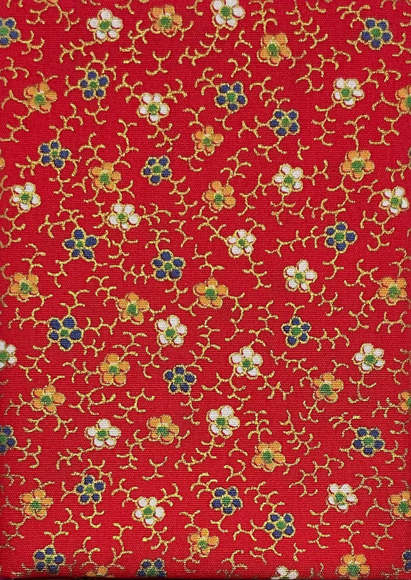 Floral print on red cotton with metallic details