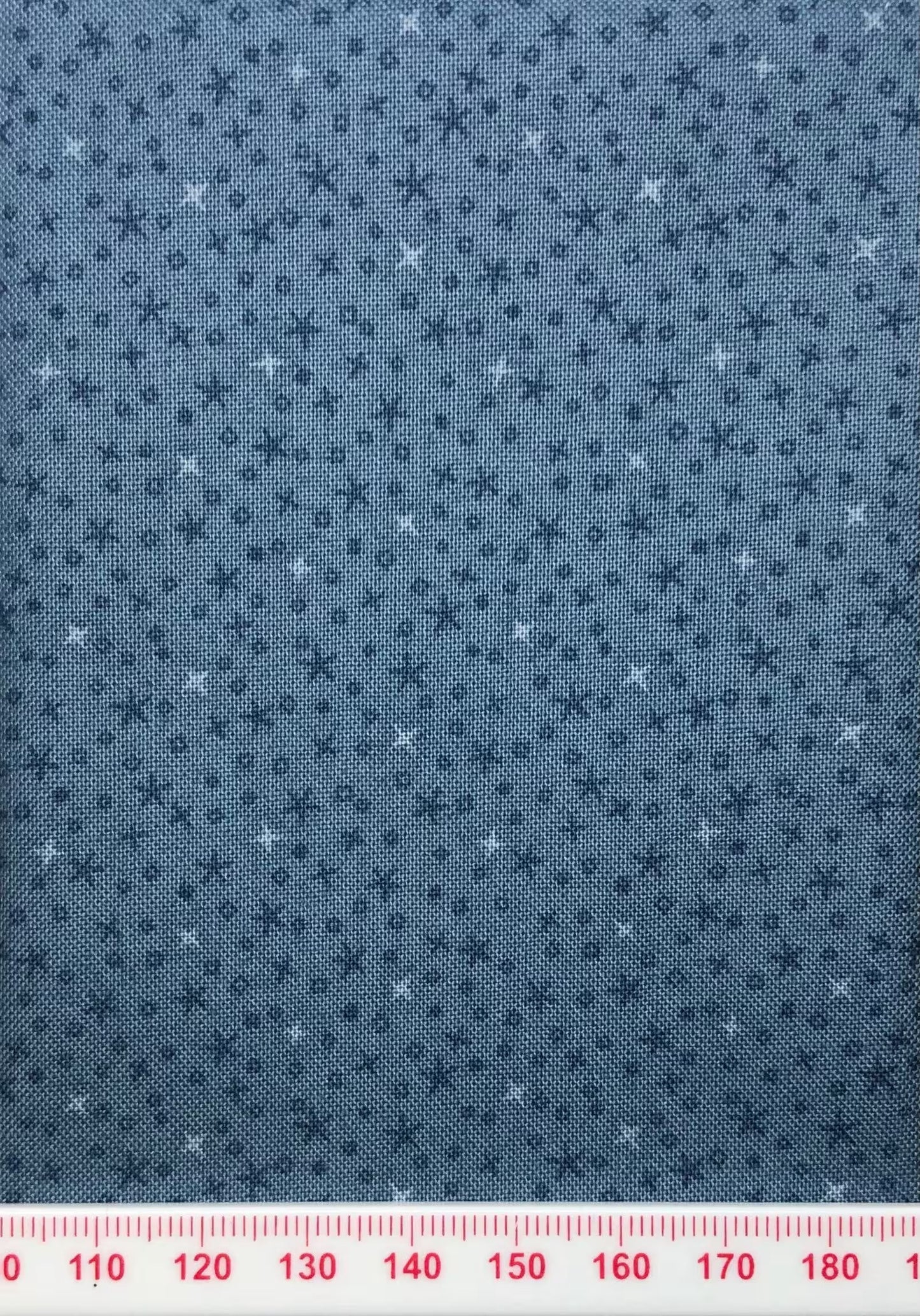 Tiny stars on a blue cotton