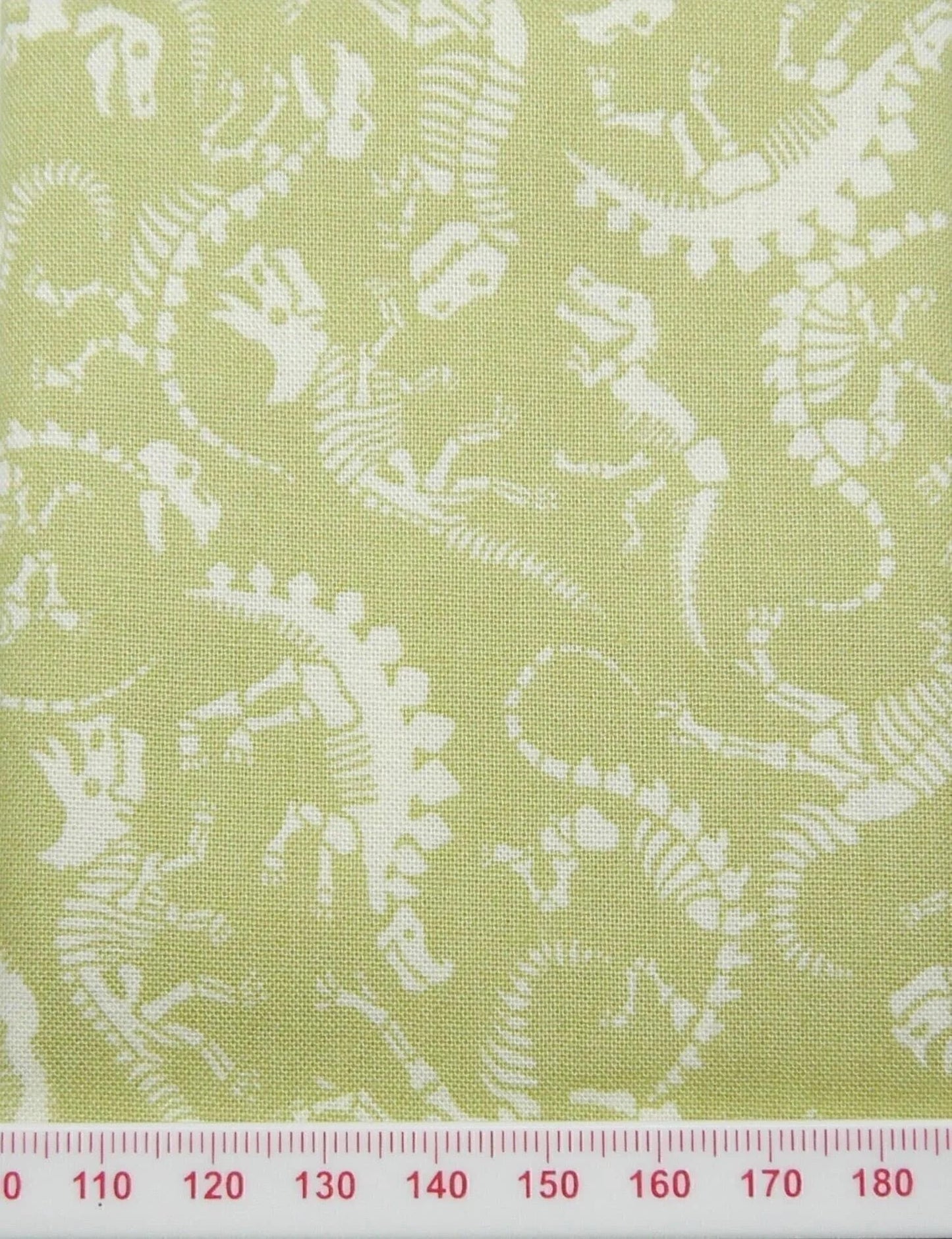 Green and white dinosaur cotton print