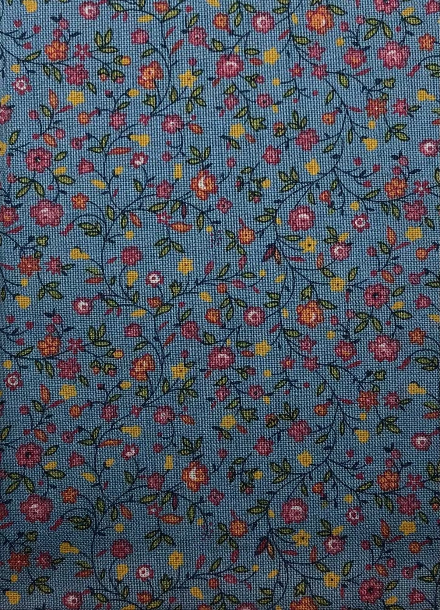 Floral pattern on blue cotton