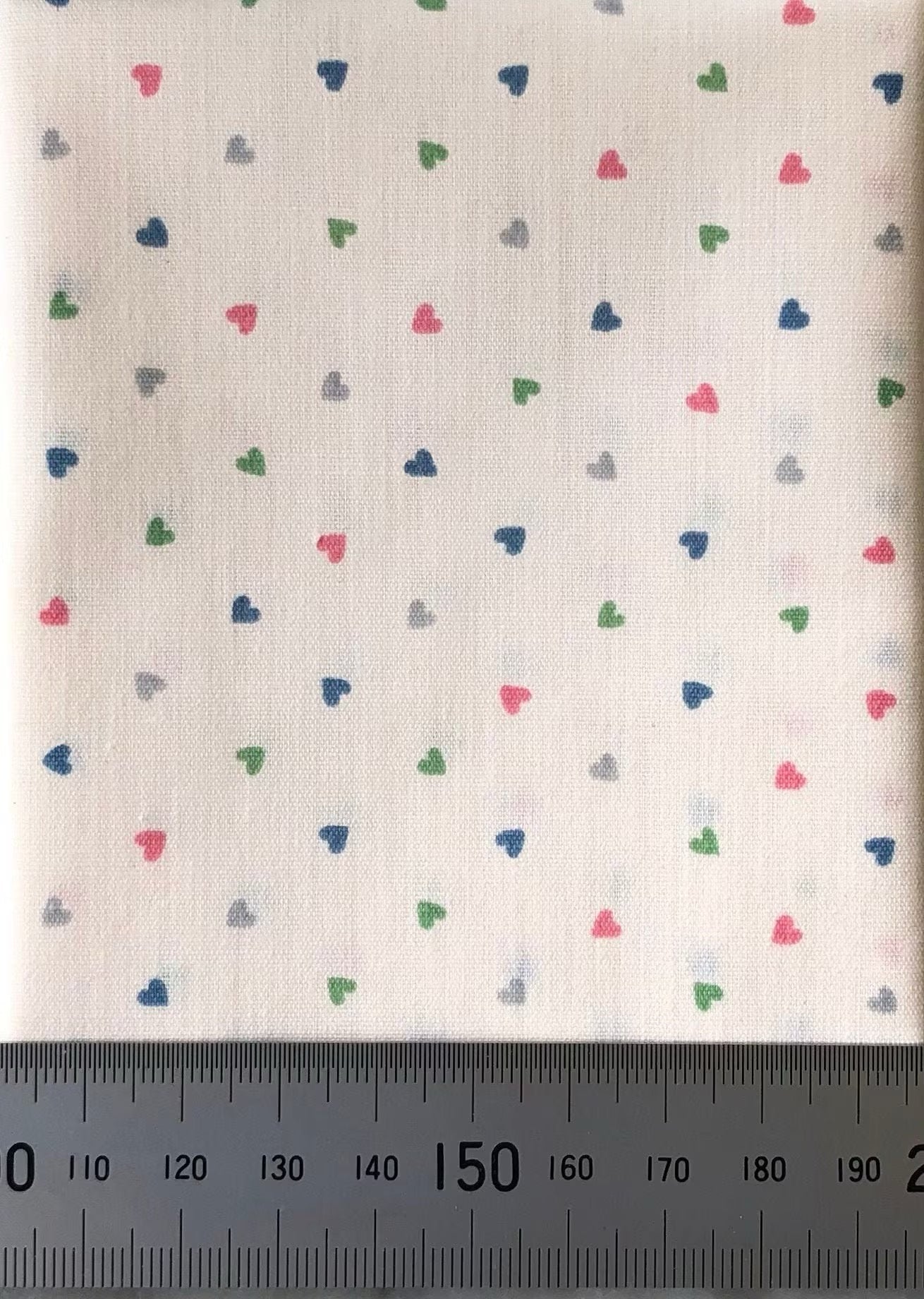 Multi-coloured hearts on cream