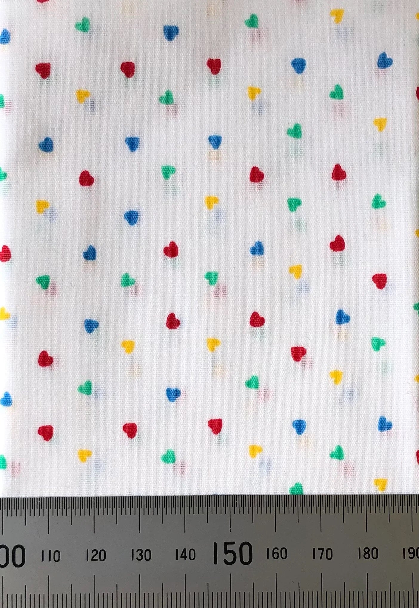 Multi-coloured hearts on white