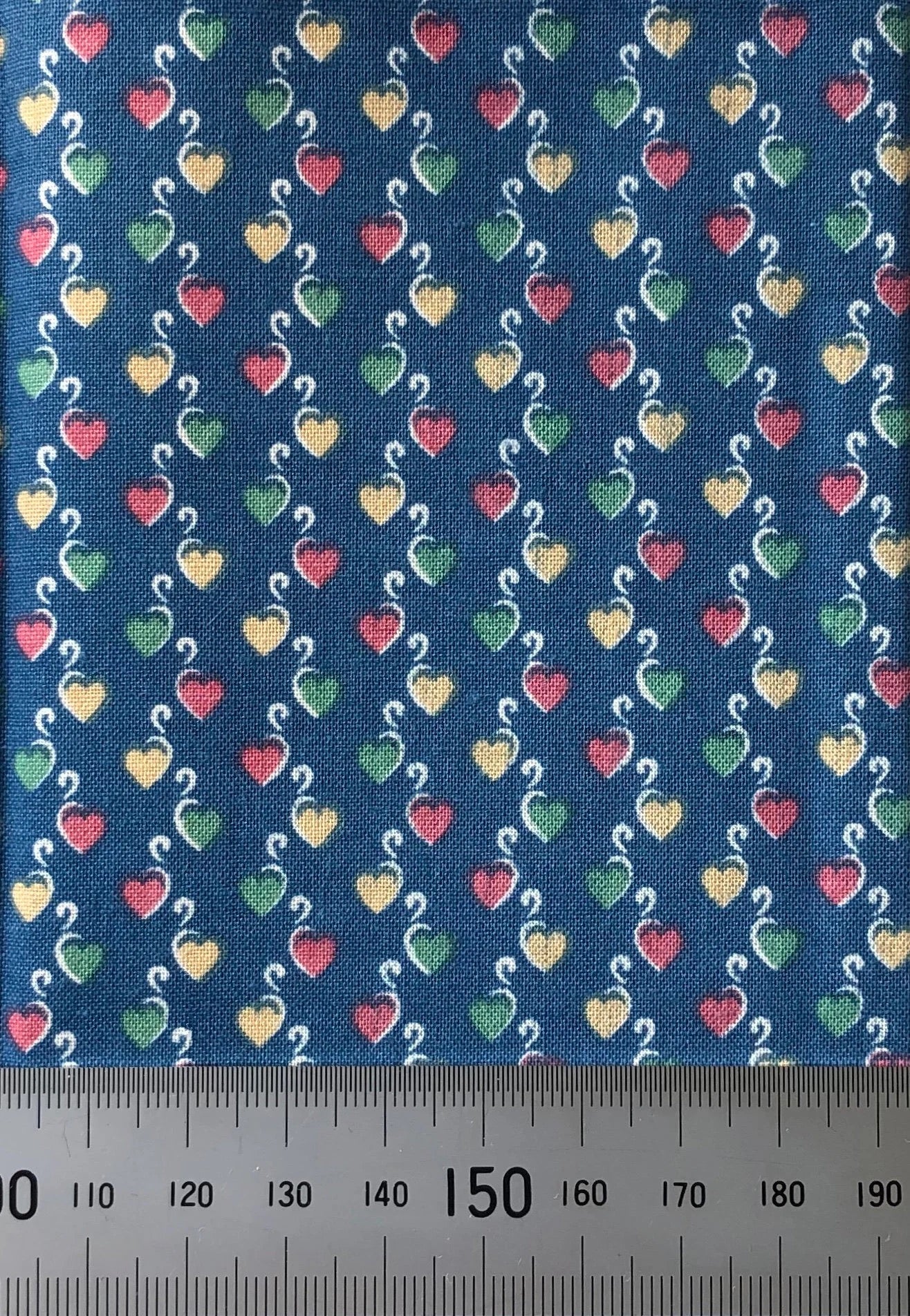 Mixed hearts on a blue cotton
