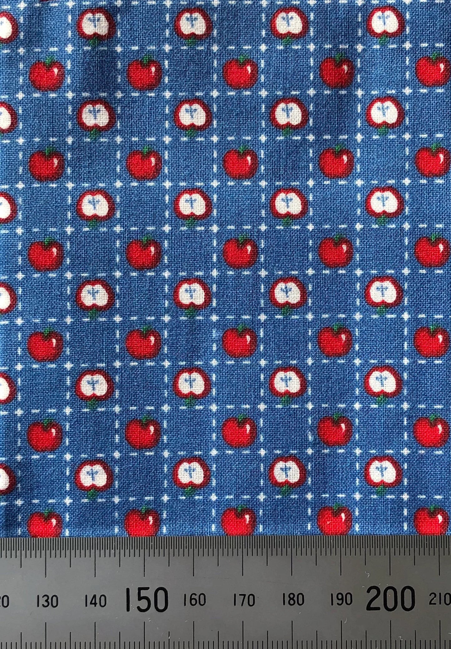Apples on blue cotton