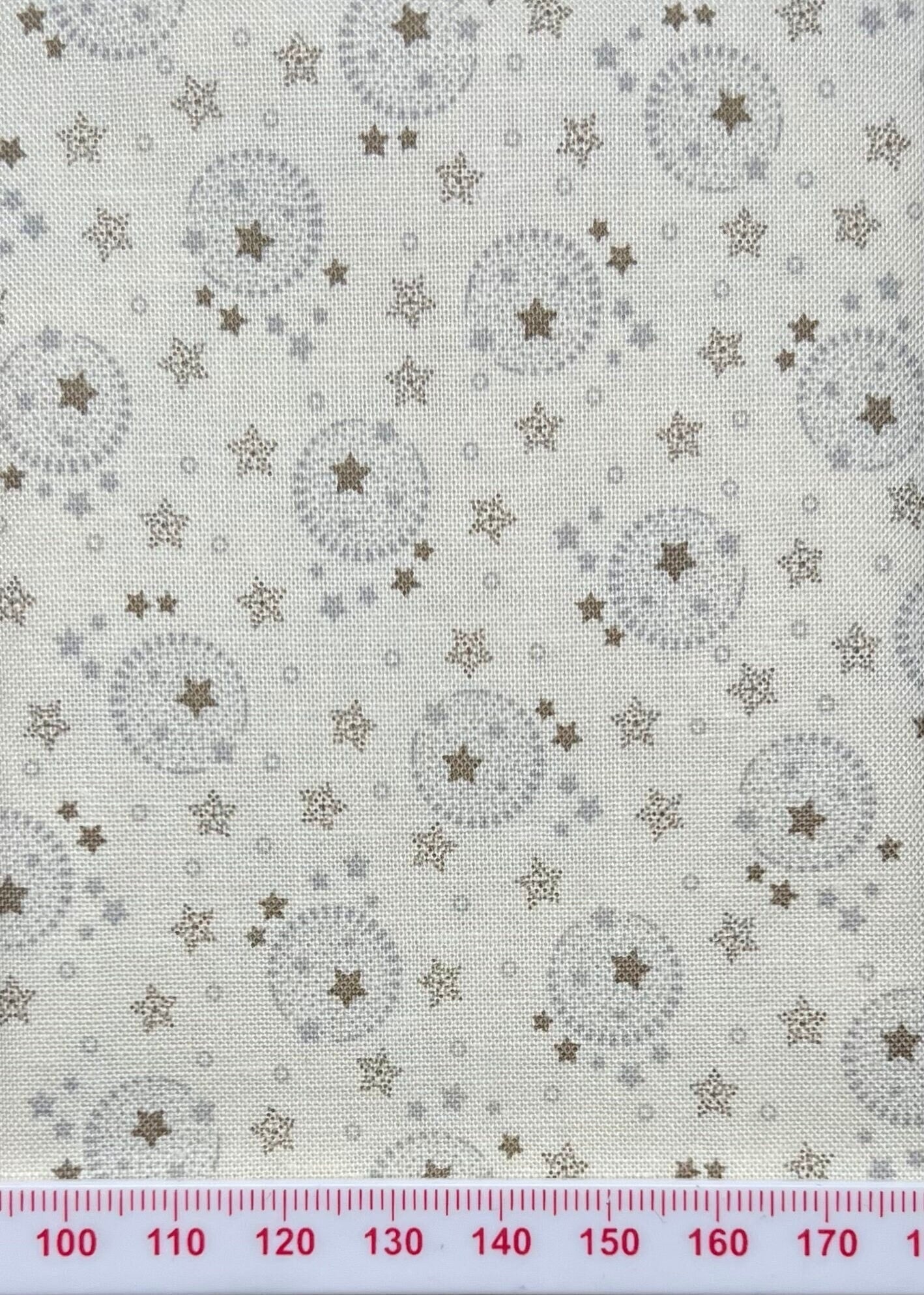 Moon and starts on cream cotton