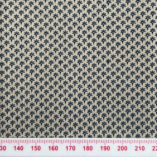 Tiny blue pattern on beige cotton