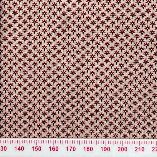 Tiny red pattern on beige cotton