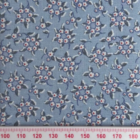 White and red flower rings on blue cotton
