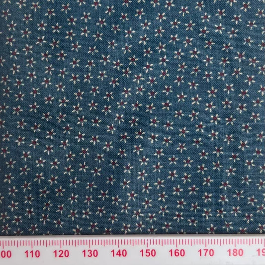 Tiny flowers on a blue cotton