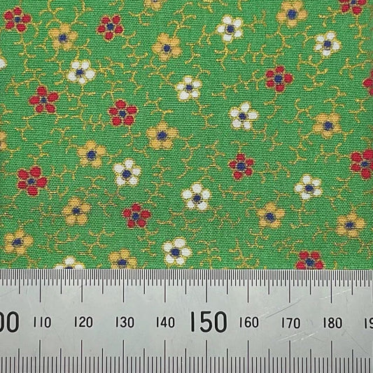 Floral print on green cotton with metallic detailing