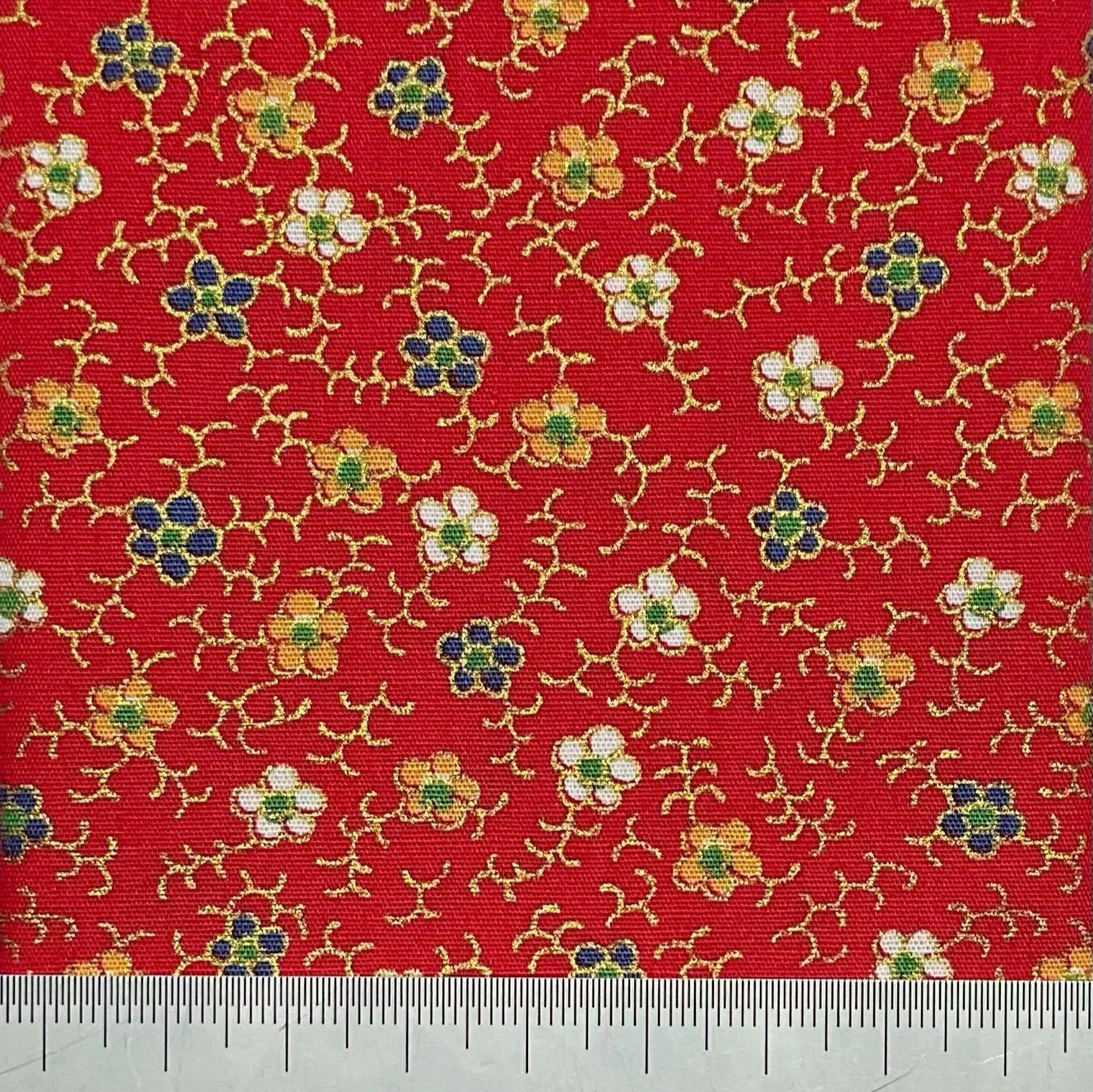 Floral print on red cotton with metallic details