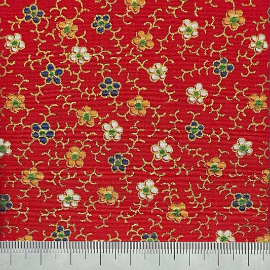 Floral print on red cotton with metallic details