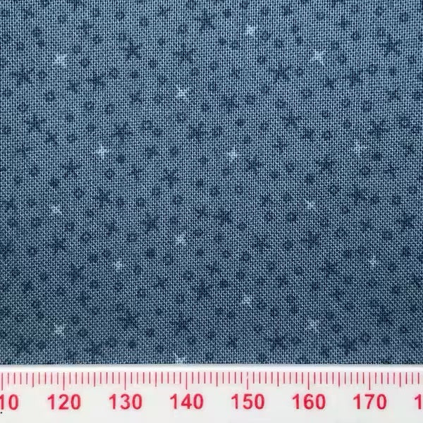 Tiny stars on a blue cotton