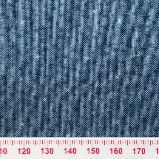 Tiny stars on a blue cotton