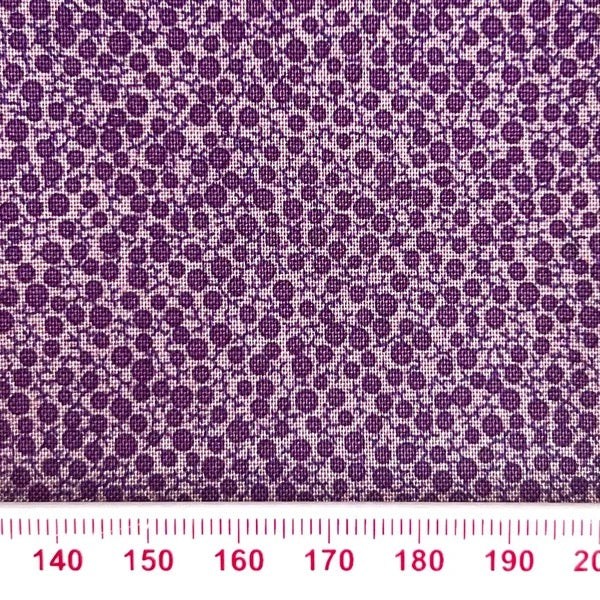Purple circles on lilac cotton