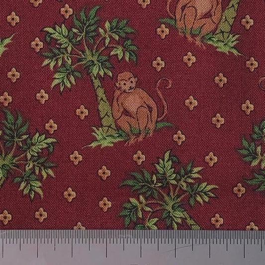 Monkeys on a burgundy cotton