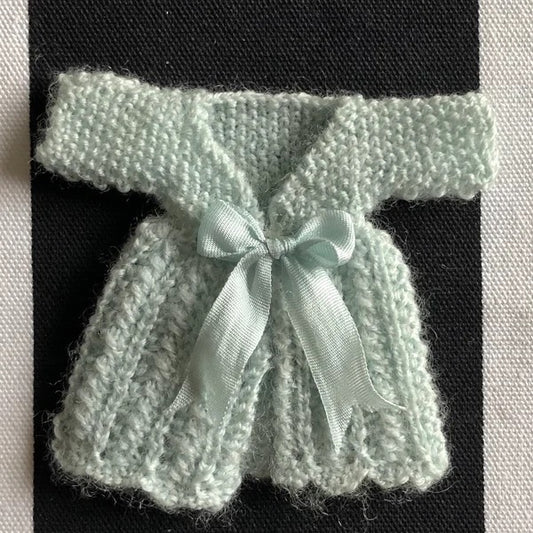 Knitting Pattern. Toddlers or small girls lacy patterned dress with short sleeves, long sleeved coat, bonnet and socks. 1:12th scale dolls