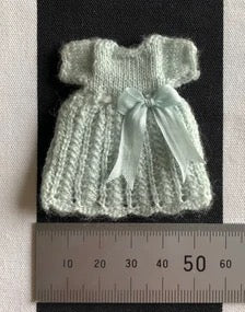 Knitting Pattern. Toddlers or small girls lacy patterned dress with short sleeves, long sleeved coat, bonnet and socks. 1:12th scale dolls