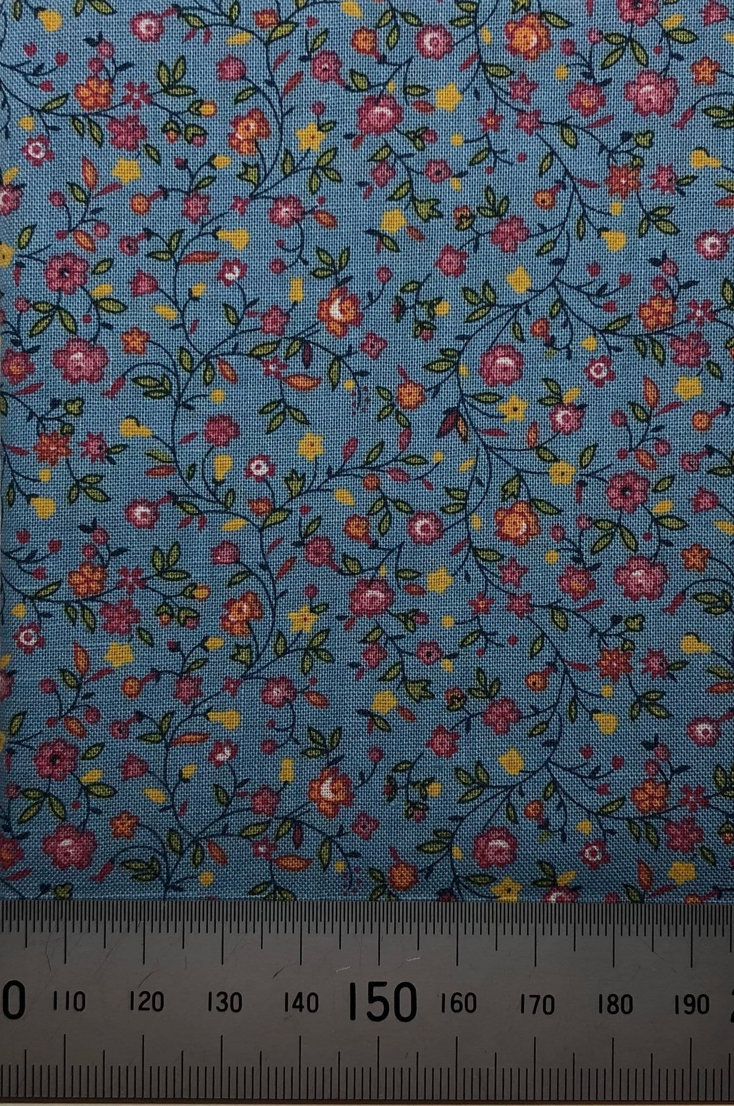 Floral pattern on blue cotton