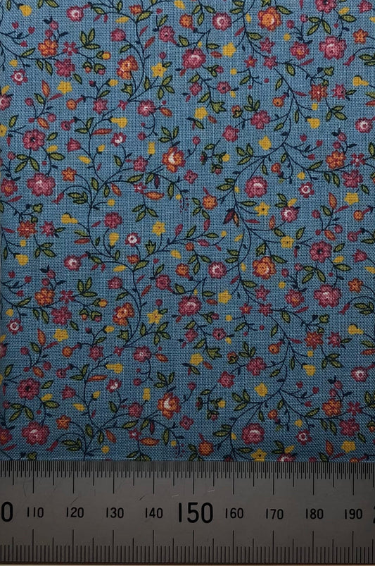 Floral pattern on blue cotton