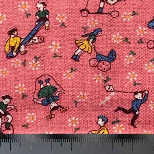Children playing on pink cotton (fat quarter)