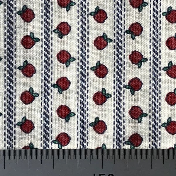 Apples on white cotton