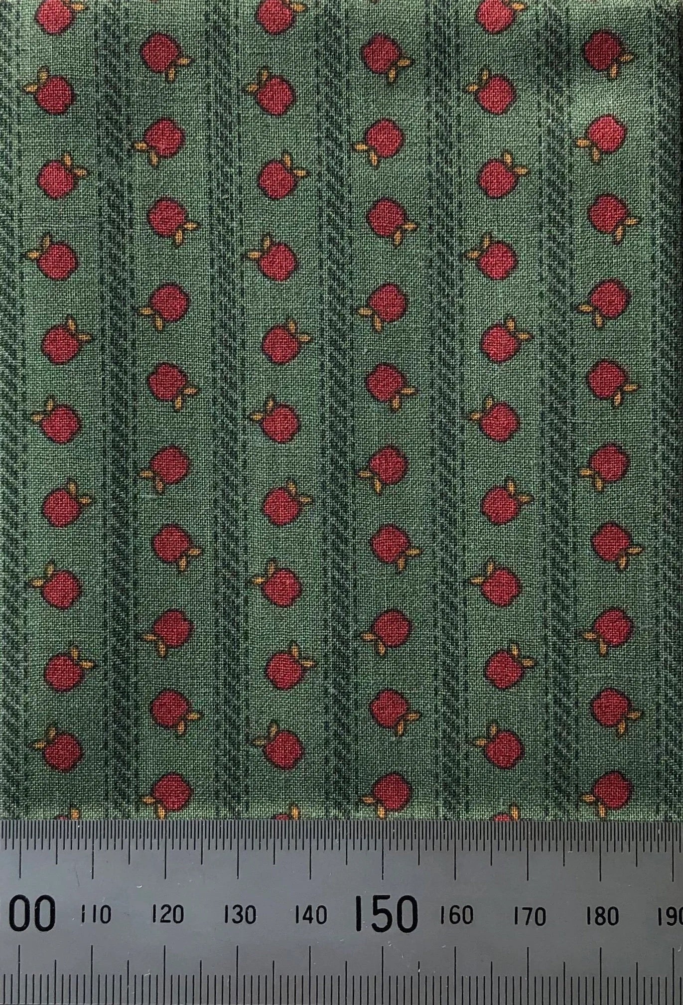 Apples on green cotton