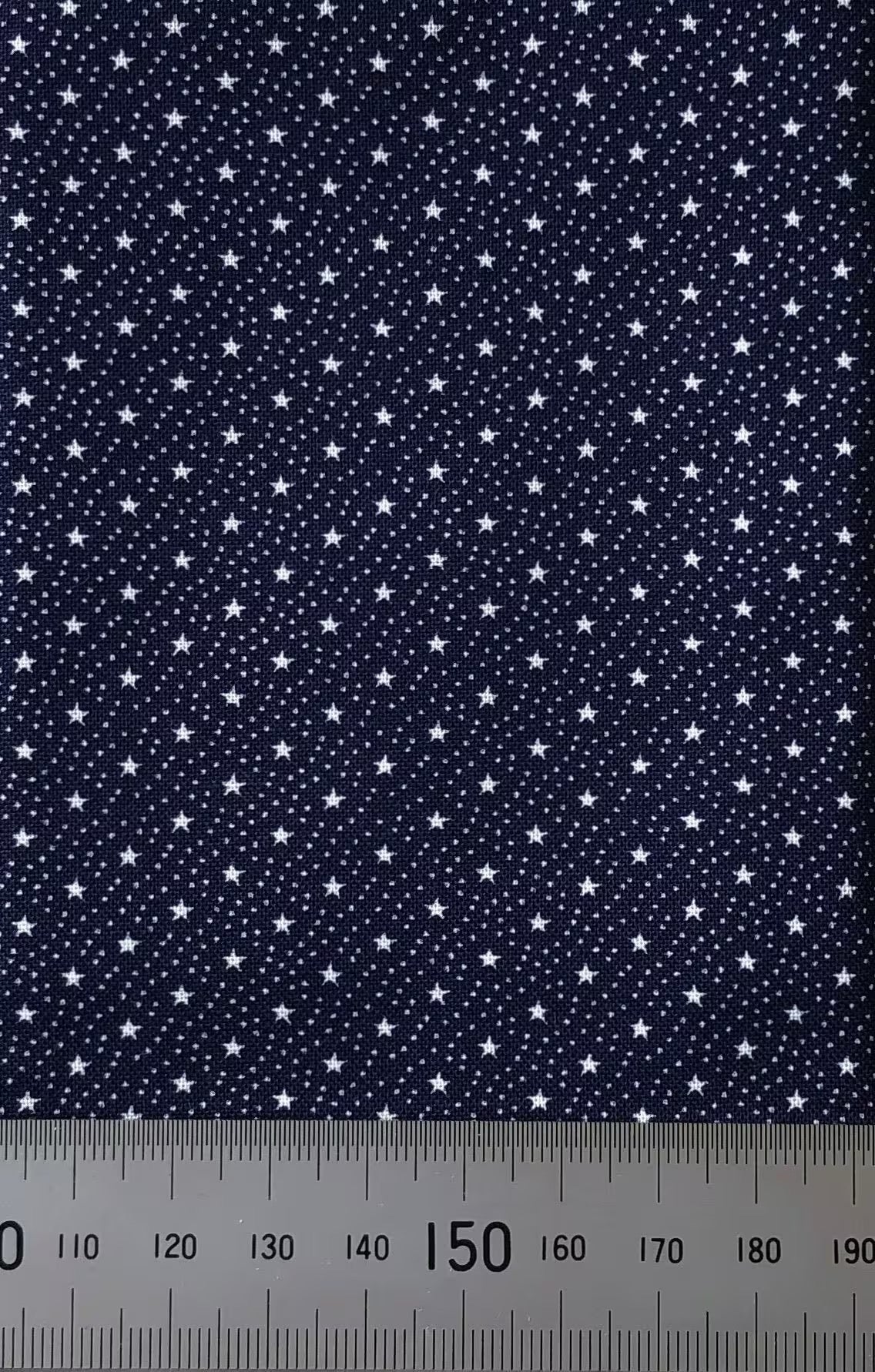 Tiny white stars on navy cotton (fat quarter)