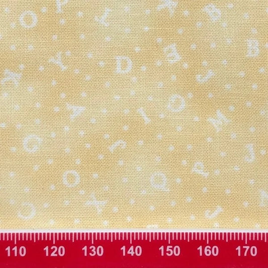 Alphabet on pale yellow cotton