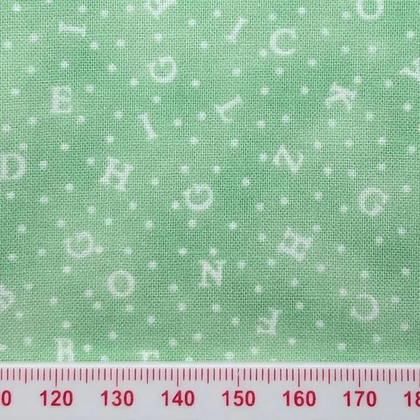 Alphabet on green cotton