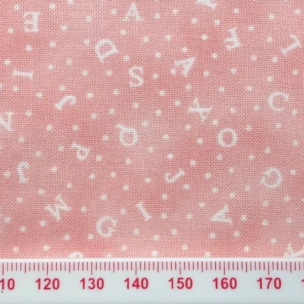 Alphabet on pink cotton