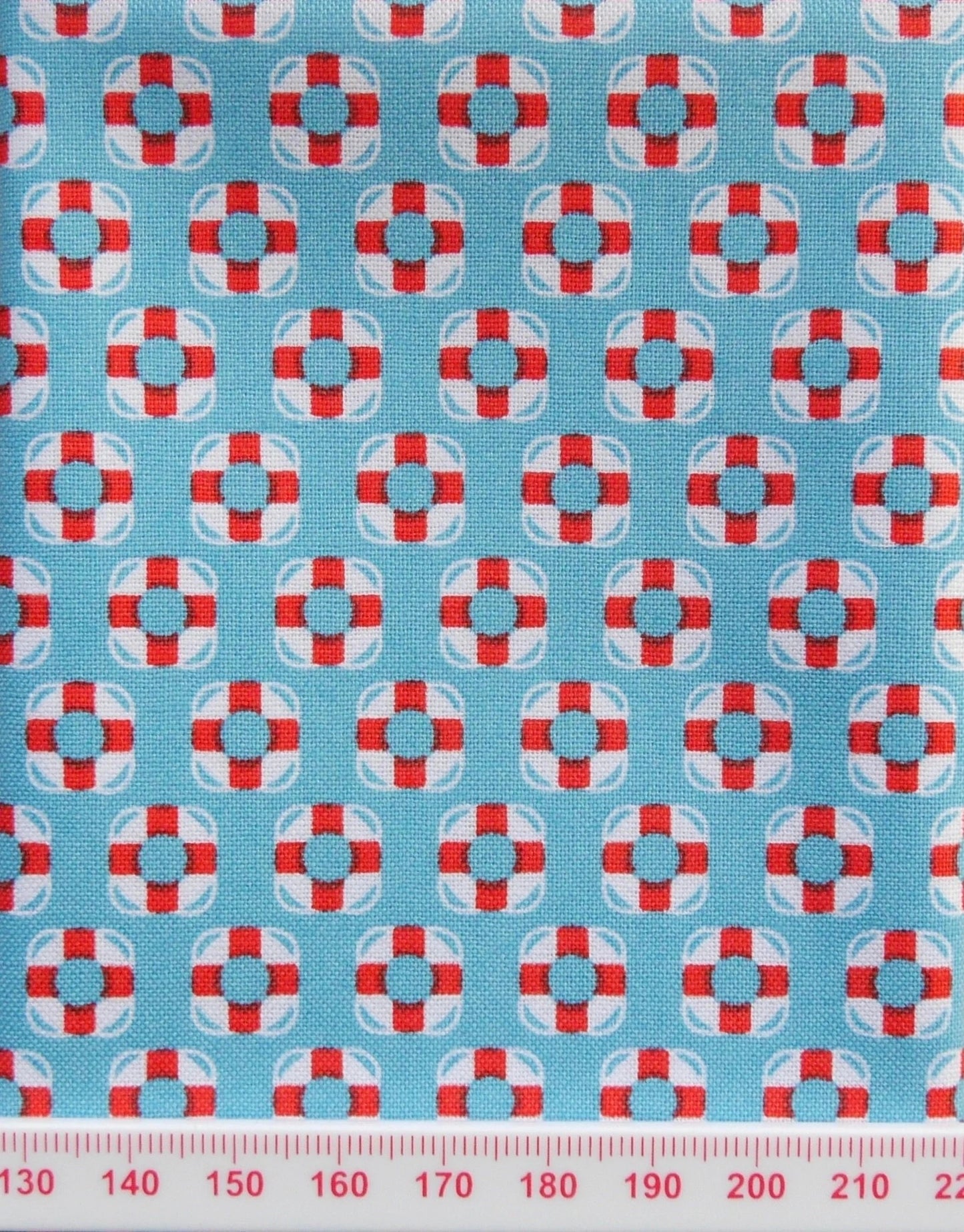 Life buoy print on blue cotton