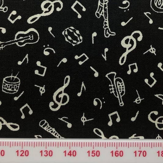 Musical symbols on black cotton